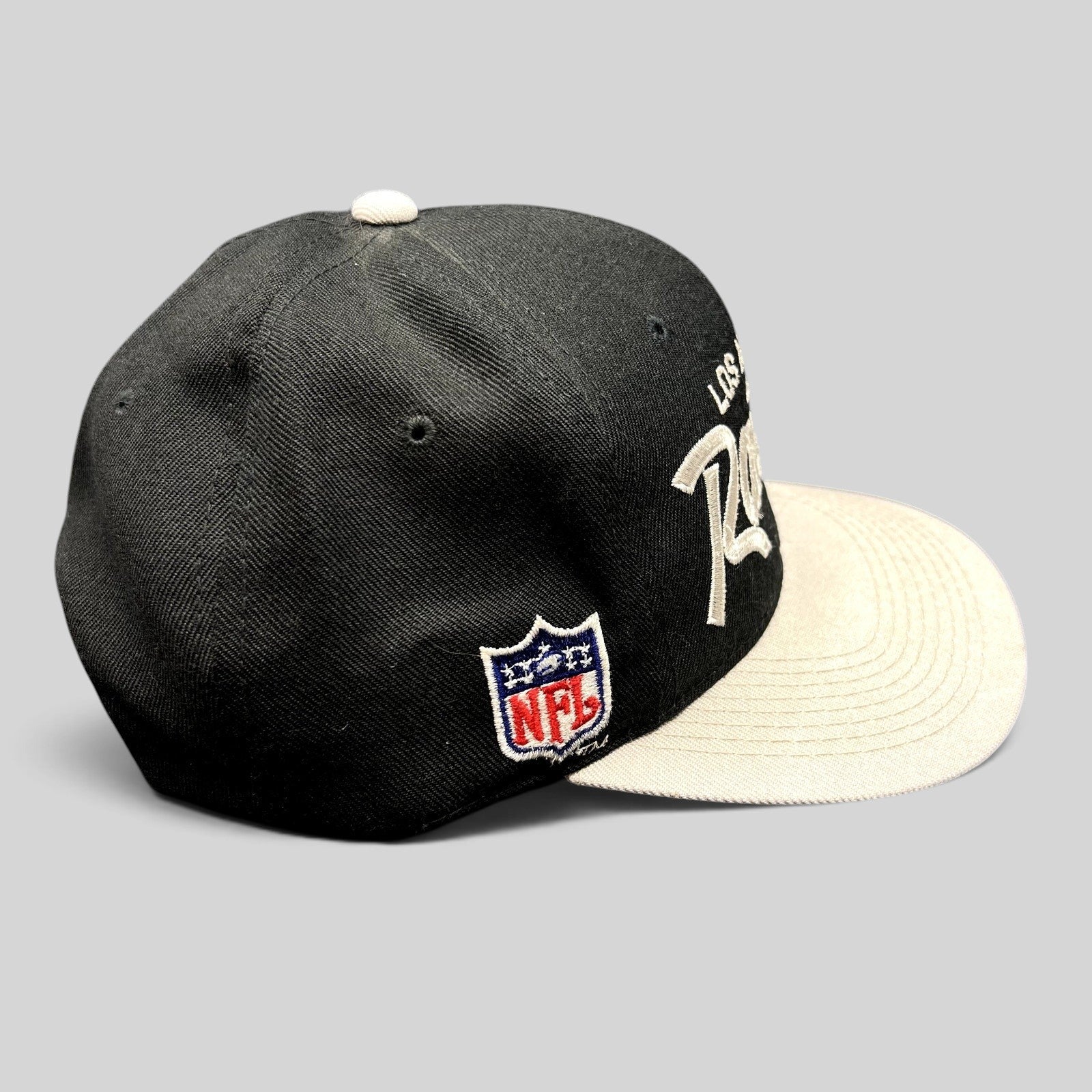 Raree Finds vintage Los Angeles Raiders Sports Specialties snapback hat with black crown, white brim, and NFL patch.