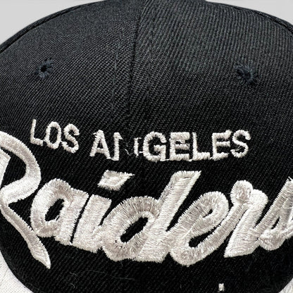 Raree Finds vintage Los Angeles Raiders snapback hat with white script embroidery on a black crown