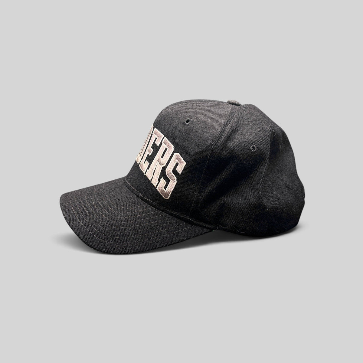 Raree Finds vintage 1990s Starter Los Angeles Raiders wool snapback hat in black with silver arch logo embroidery