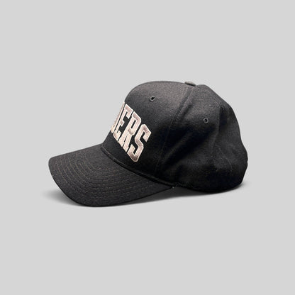 Raree Finds vintage 1990s Starter Los Angeles Raiders wool snapback hat in black with silver arch logo embroidery