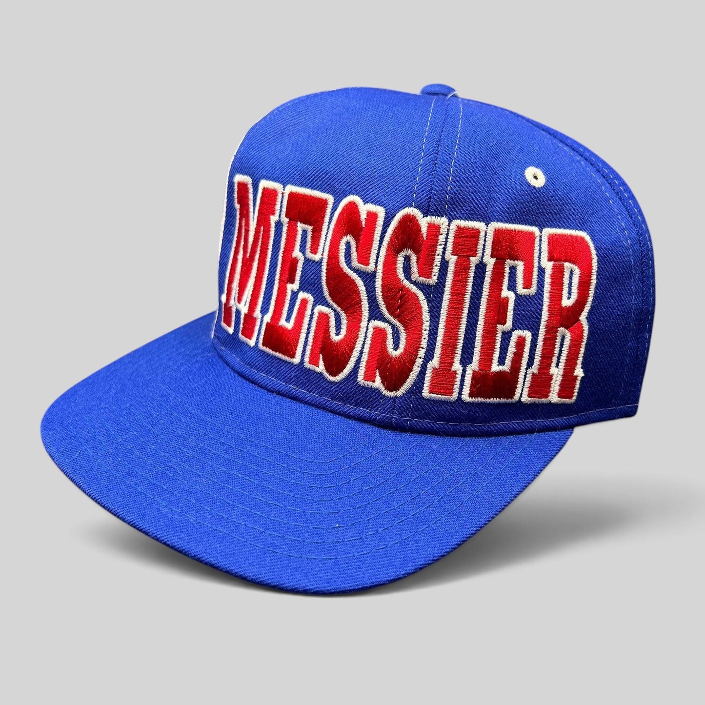 Raree Finds vintage Starter New York Rangers wool snapback hat featuring red Messier embroidery on a blue cap.