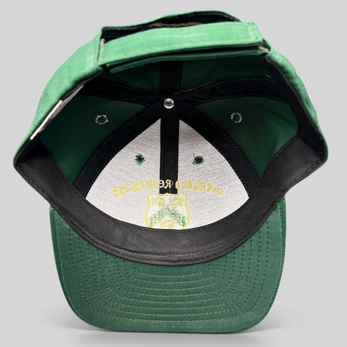 Raree Finds vintage green snapback hat featuring The Ronald Reagan Pub embroidered crest on the interior crown