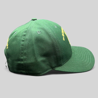 Raree Finds vintage green snapback hat with gold embroidered Ronald Reagan Pub crest from Ballyporeen, Ireland.