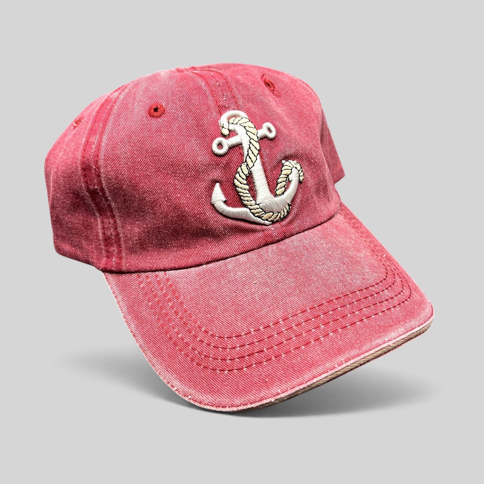 Raree Finds vintage washed red cotton strapback hat featuring a detailed embroidered silver anchor and rope design.