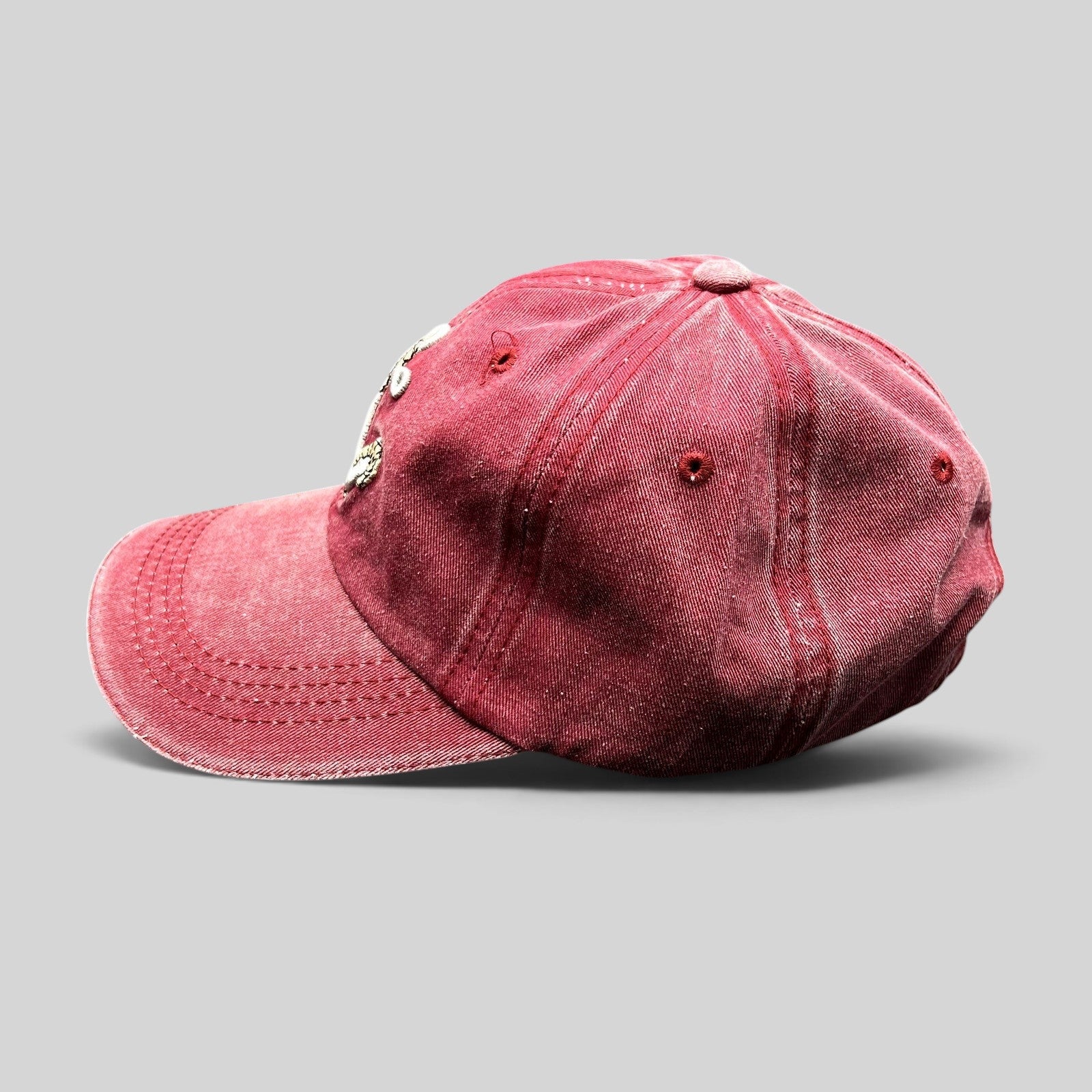 Raree Finds vintage washed red cotton strapback hat with embroidered silver anchor and rope design, side view.