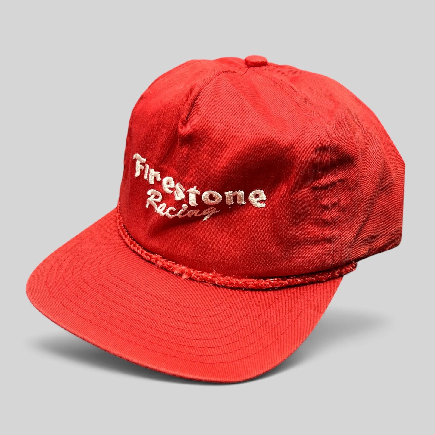 Raree Finds vintage red Firestone Racing snapback hat with white embroidered logo and braided rope brim detail