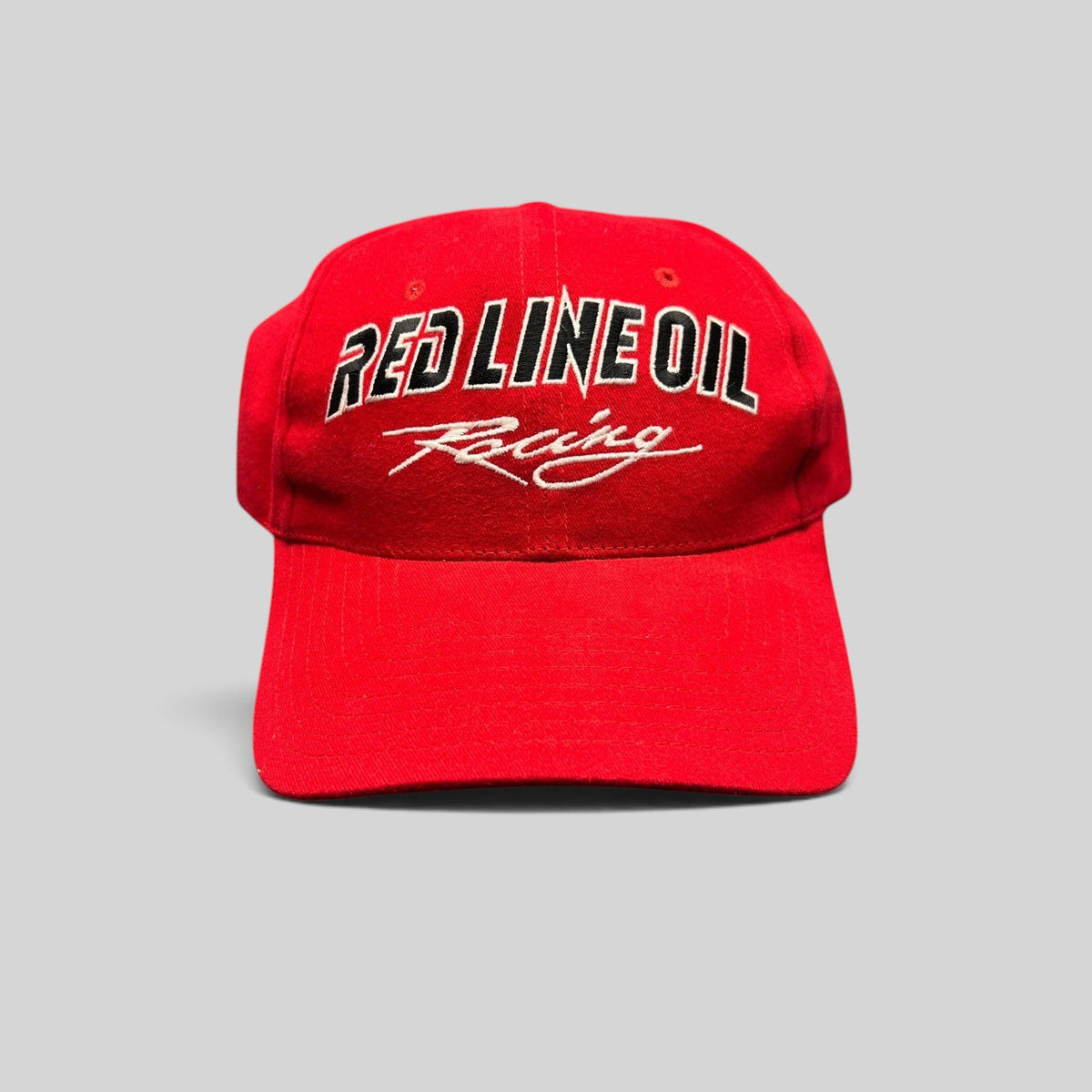 Raree Finds vintage red Red Line Oil Racing snapback hat with black and white embroidered logo and curved brim