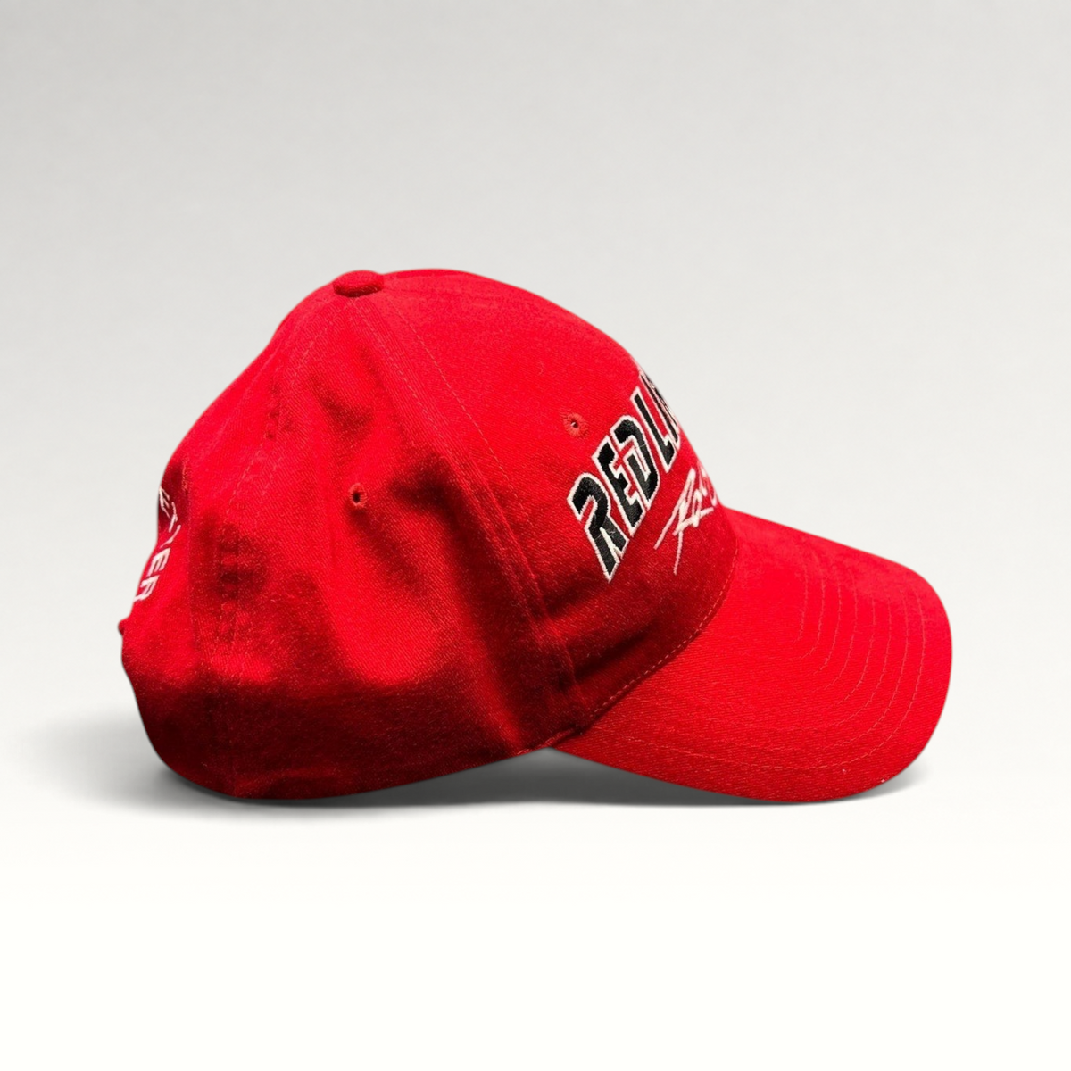 Raree Finds vintage red Kudzu snapback hat with Red Line Oil Racing embroidery and curved brim on black background
