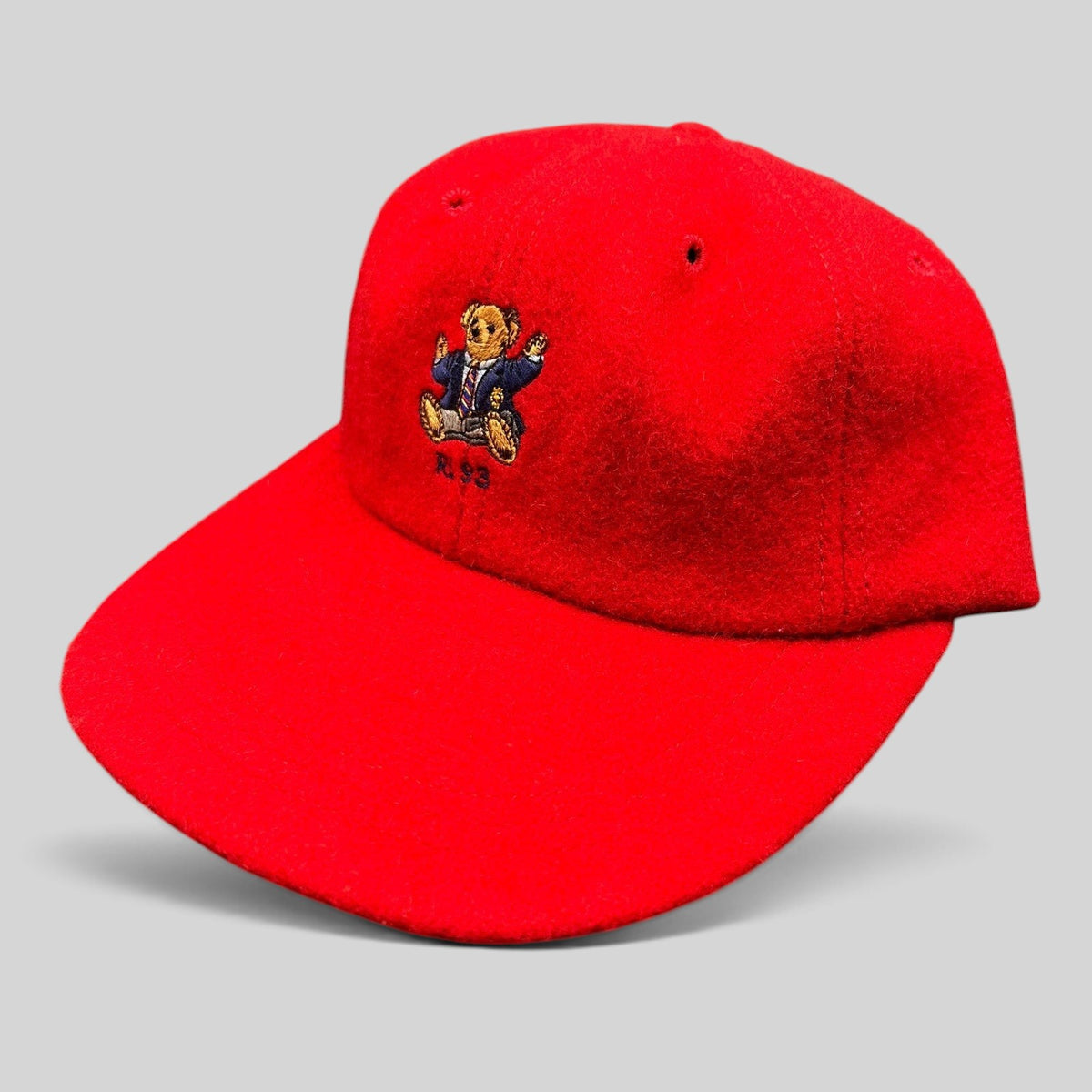 Raree Finds vintage red wool Polo Ralph Lauren cap featuring an embroidered suited Polo Bear and RL 93 logo