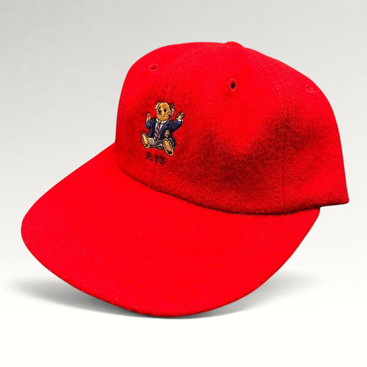 Raree Finds vintage red wool Polo Ralph Lauren cap featuring an embroidered suited Polo Bear and RL 93 logo
