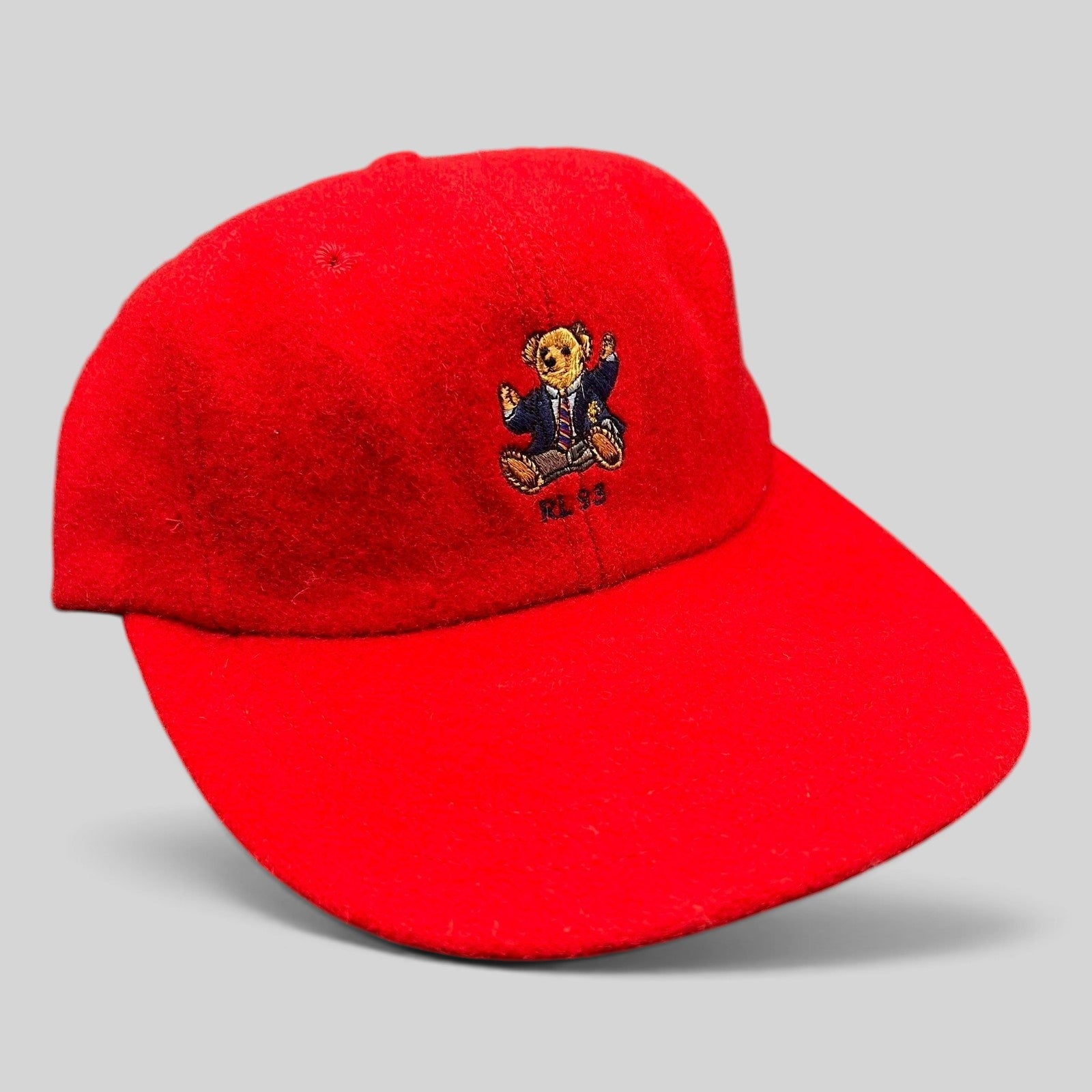 Raree Finds vintage red wool Polo Ralph Lauren cap featuring an embroidered suited teddy bear and RL 93 logo
