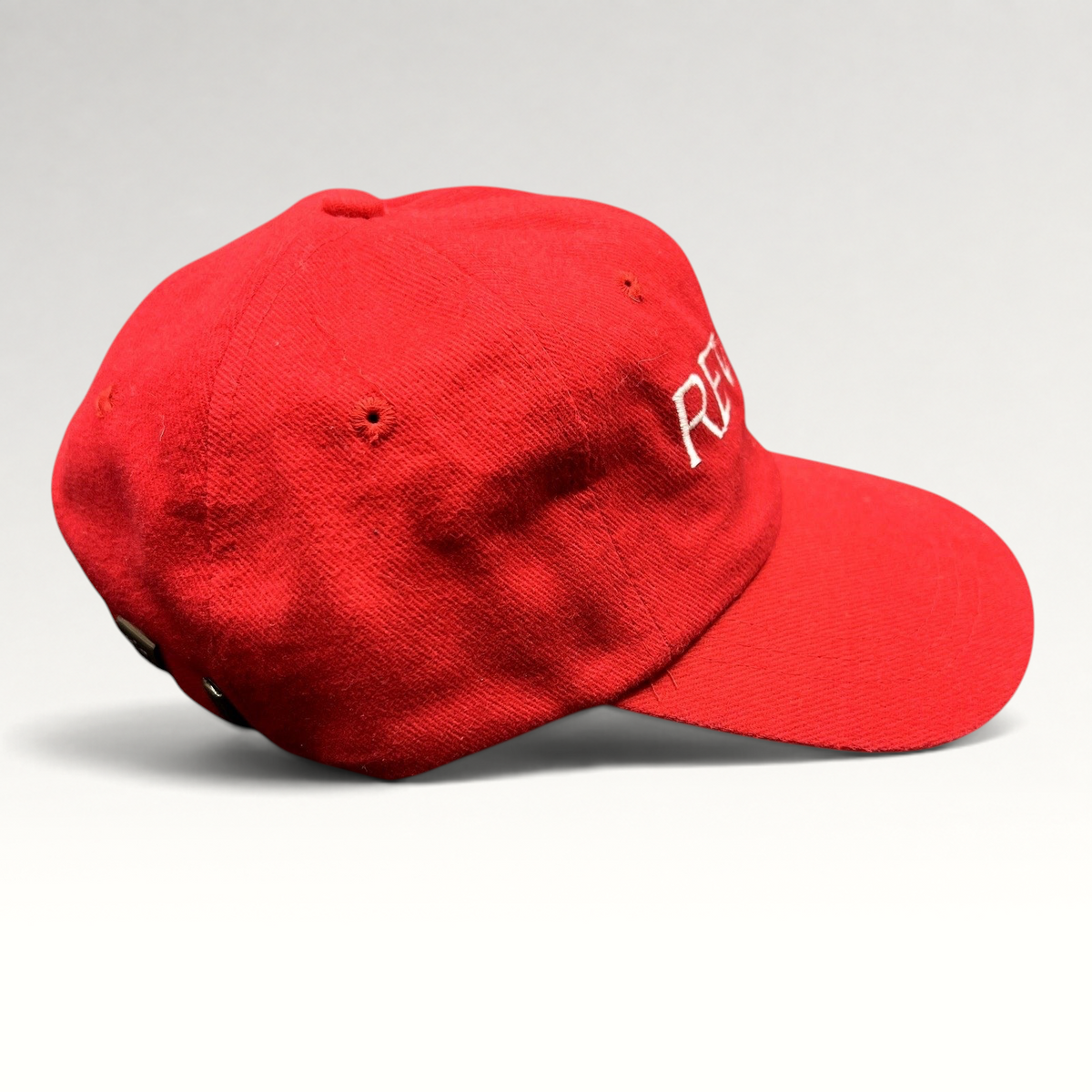 Raree Finds vintage red Revlon promotional strapback hat with white embroidered lettering on the front panel