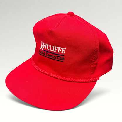 Raree Finds vintage red snapback hat with white Wycliffe Golf & Country Club embroidery and decorative rope trim.