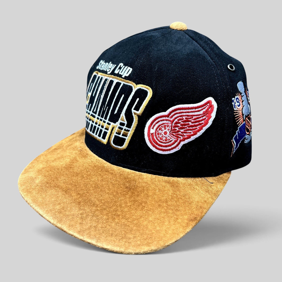 Raree Finds vintage 1997 Detroit Red Wings Stanley Cup Champions Starter strapback hat with black crown and tan brim.