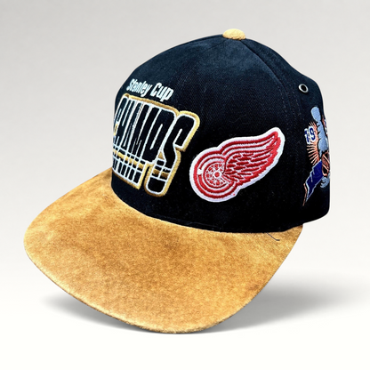 Raree Finds vintage 1997 Detroit Red Wings Stanley Cup Champions Starter strapback hat with black crown and tan brim.