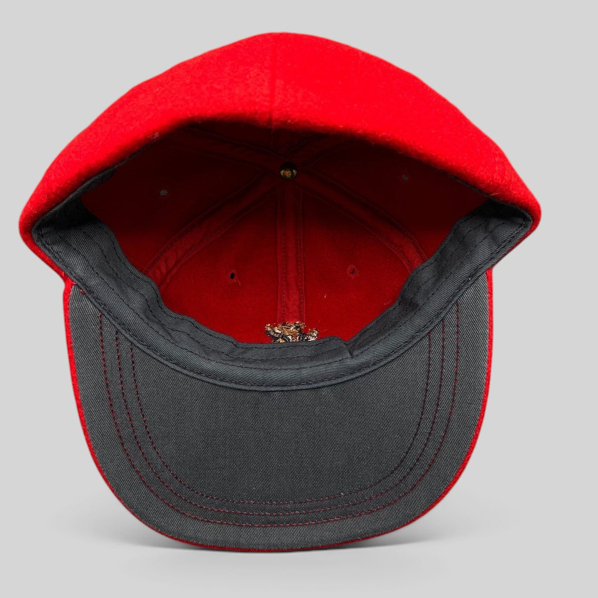 Raree Finds vintage red wool Polo Ralph Lauren cap interior view showing the structured crown and dark brim lining
