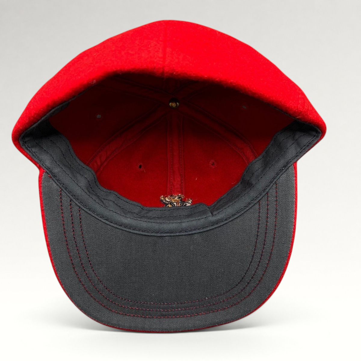 Raree Finds vintage red wool Polo Ralph Lauren cap interior view showing the structured crown and dark brim lining