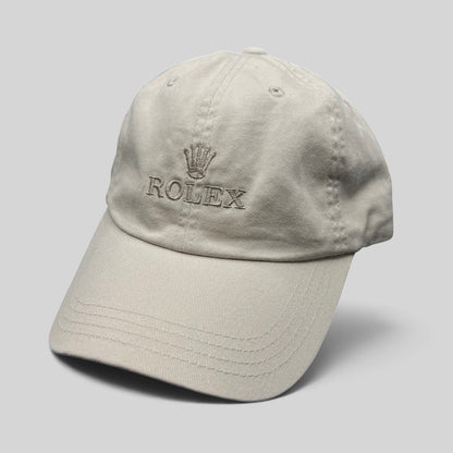 Raree Finds vintage khaki cotton Rolex strapback golf hat with embroidered crown logo on a neutral beige cap