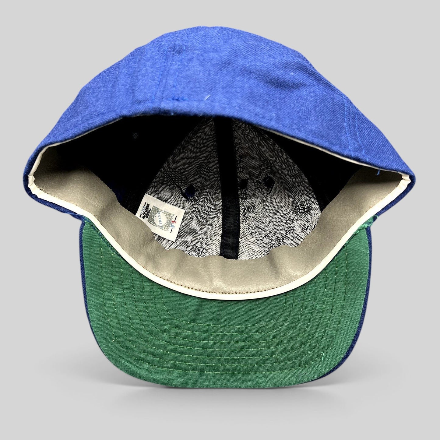 Raree Finds vintage Roman Pro wool baseball cap in royal blue with a green undervisor and leather sweatband interior.