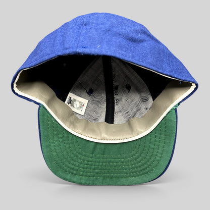 Raree Finds vintage Roman Pro wool baseball cap in royal blue with a green undervisor and leather sweatband interior.