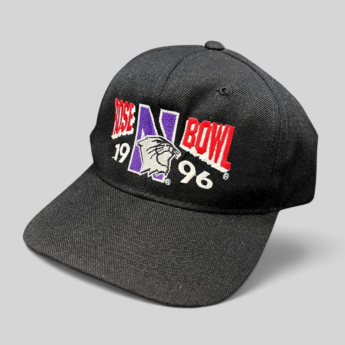 Raree Finds vintage 1996 Rose Bowl Northwestern Wildcats snapback hat in black wool blend with embroidered logo.