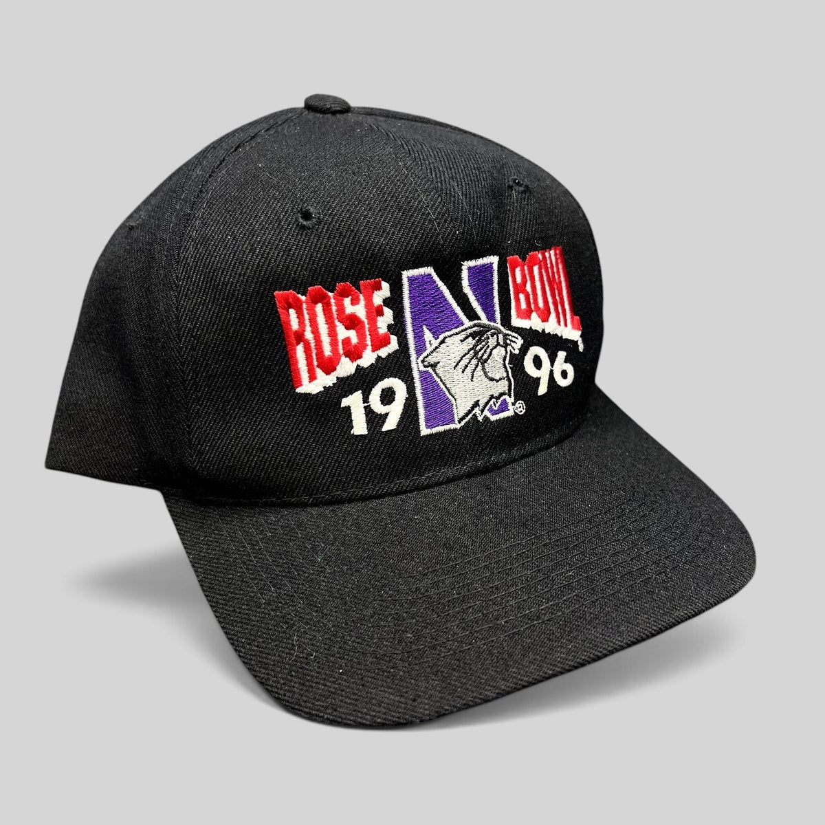 Raree Finds vintage 1996 Rose Bowl Northwestern Wildcats black wool blend snapback hat with embroidered graphics