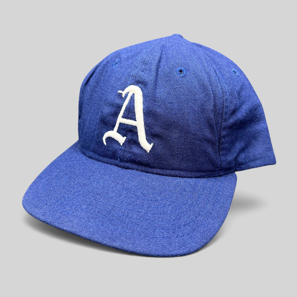 Raree Finds vintage Roman Pro royal blue wool baseball cap with white embroidered A logo and green undervisor