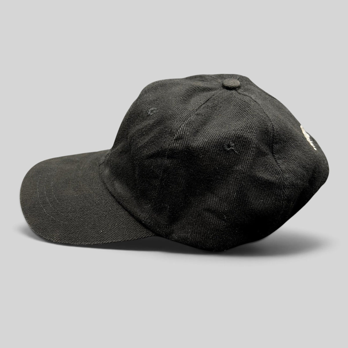 Raree Finds vintage 1990s black cotton strapback hat with white Sandeman Port wine bottle logo embroidery