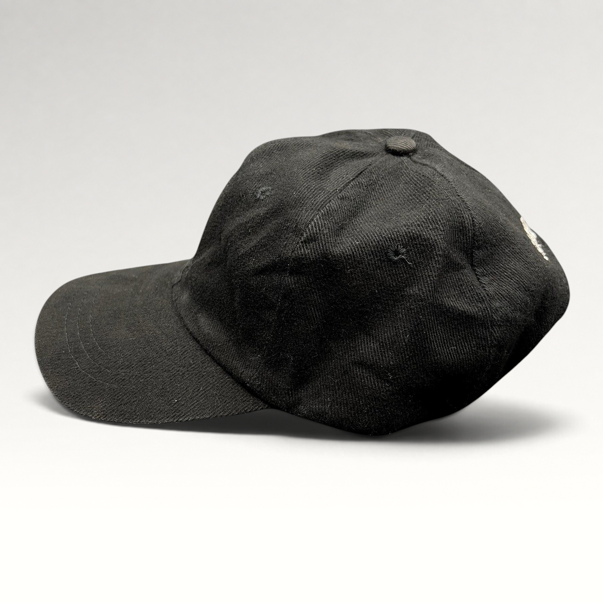Raree Finds vintage 1990s black cotton strapback hat with white Sandeman Port Wine logo embroidery