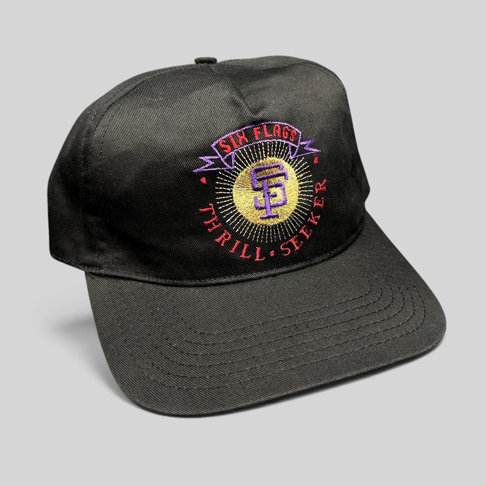 Raree Finds vintage 90s Six Flags Thrill Seeker black snapback hat with colorful embroidered amusement park logo