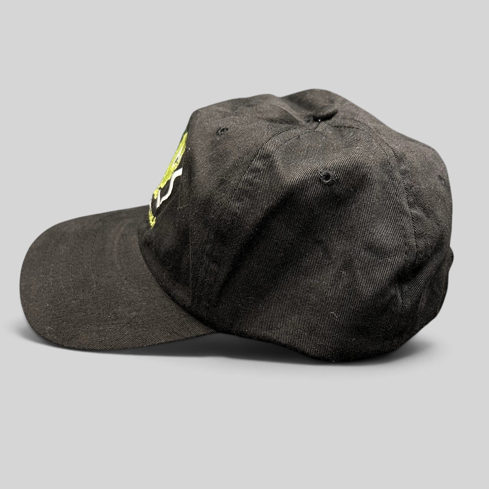 Raree Finds vintage black snapback hat with green and white Smoking Sucks embroidered cartoon graphic and curved brim
