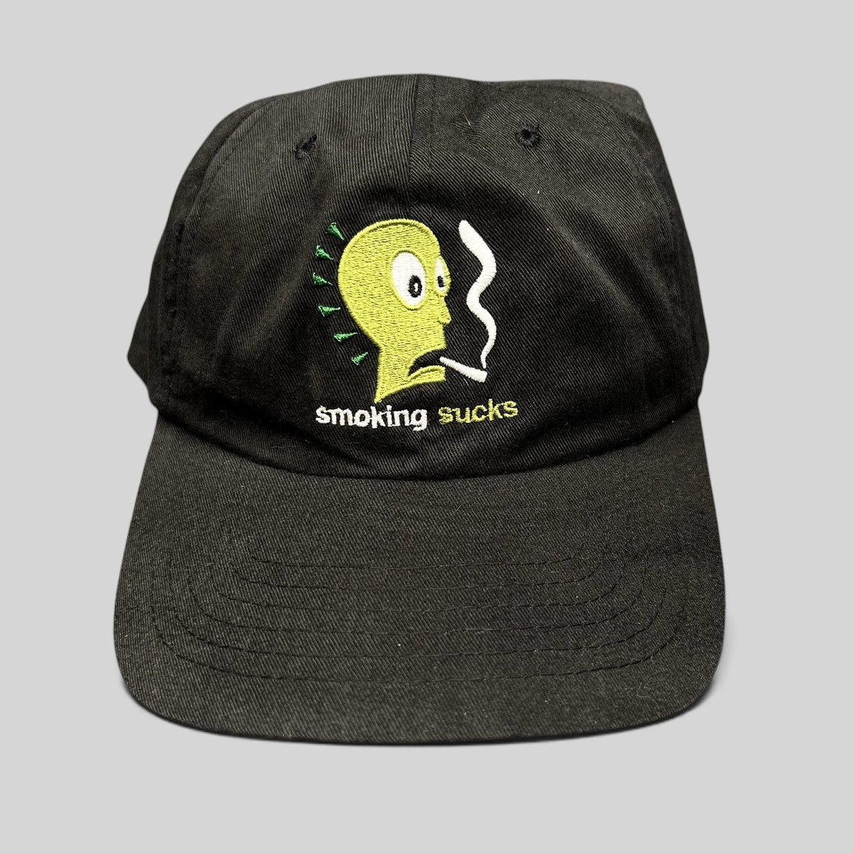 Raree Finds vintage black snapback hat with embroidered green cartoon character and Smoking Sucks text