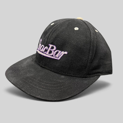 Raree Finds vintage 90s black snapback hat with purple Snack Bar script embroidery and a light gray brim