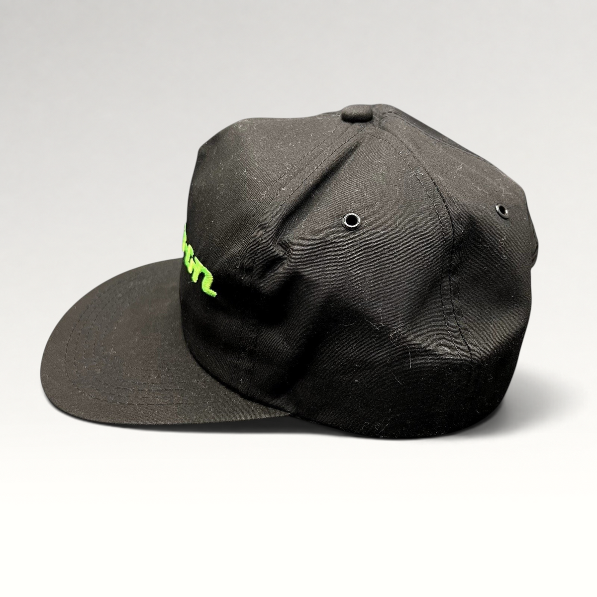 Raree Finds vintage 90s black snapback hat with neon green Snap-on Tools embroidered logo and adjustable closure