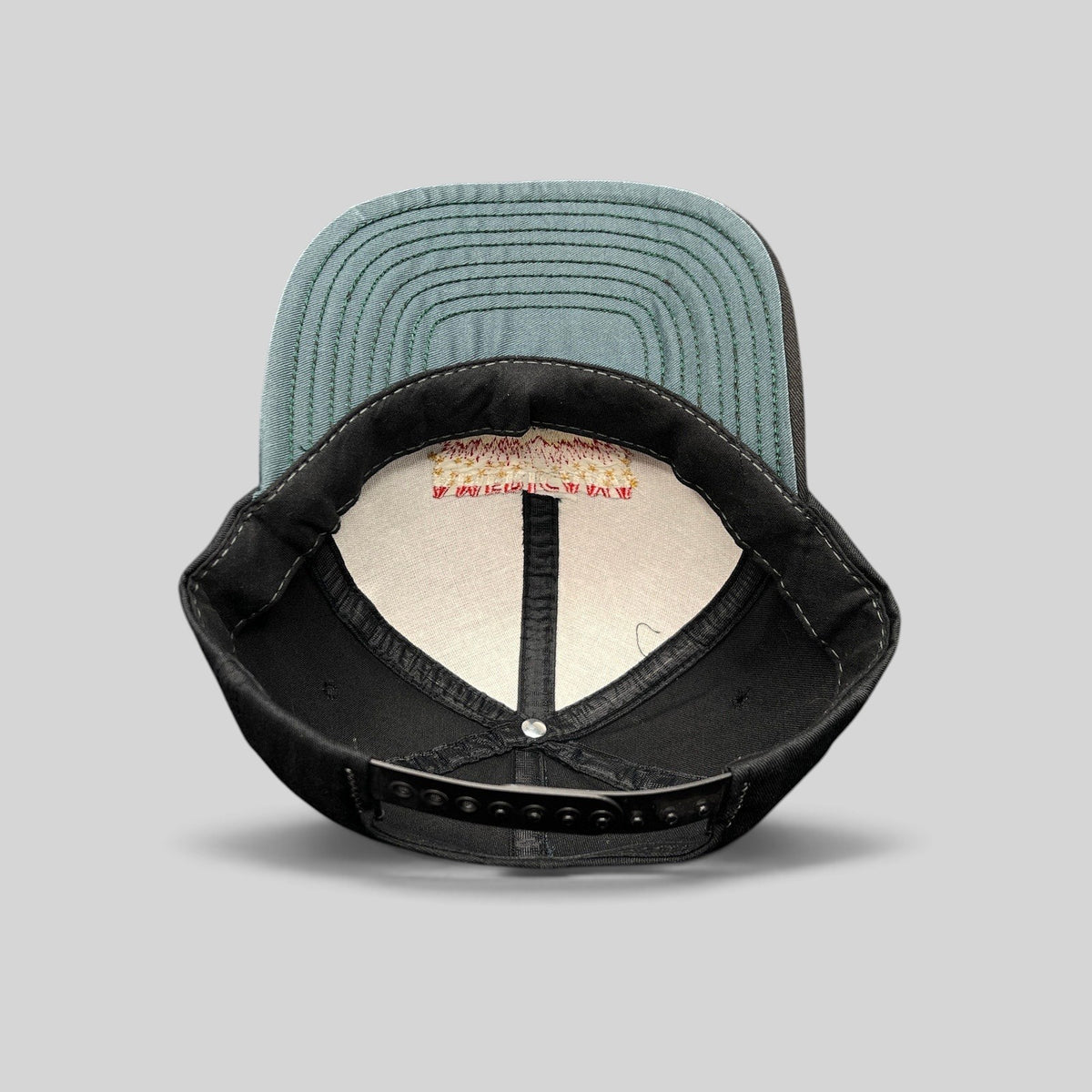 Raree Finds vintage Americana Fireworks snapback hat interior showing green undervisor and adjustable plastic strap