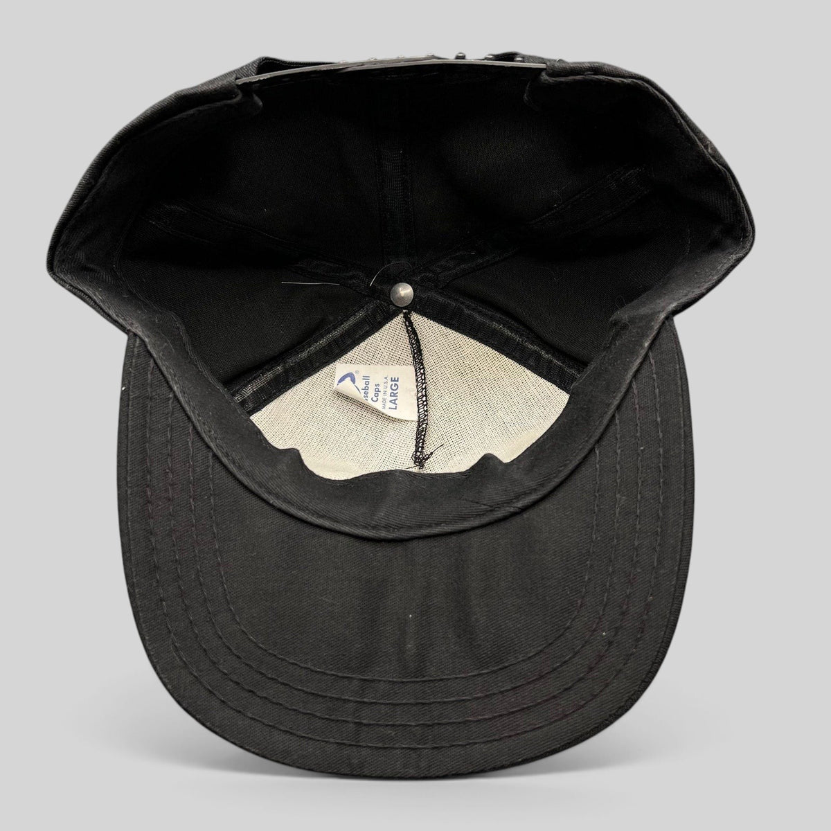 Interior view of a vintage Raree Finds Jack Daniel’s snapback hat showing the AJD Baseball Caps label and construction