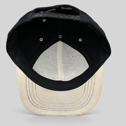 Raree Finds vintage 90s snapback hat interior view showing black crown, light gray brim, and plastic snap closure