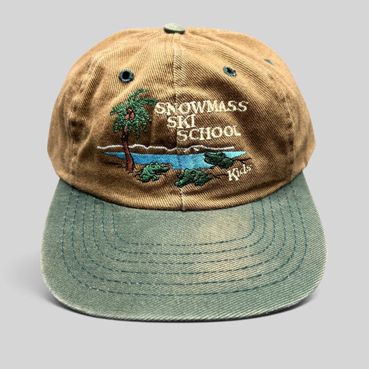 Raree Finds vintage Snowmass Ski School kids snapback hat in brown and green with tropical alligator embroidery.