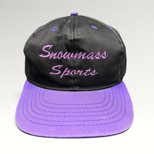 Raree Finds vintage 90s Snowmass Sports strapback hat with a black crown and vibrant purple brim and embroidery.