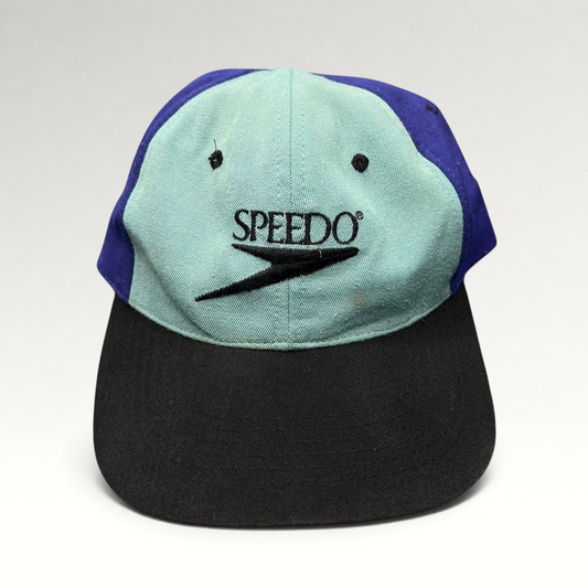Raree Finds vintage Speedo 90s colorblock snapback hat with teal, royal blue, and black panels and embroidered logo.