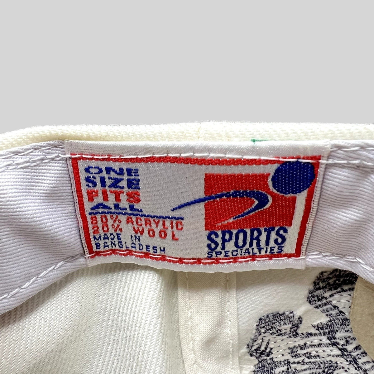Raree Finds vintage Sports Specialties NFL hat interior tag showing material composition and manufacturing details