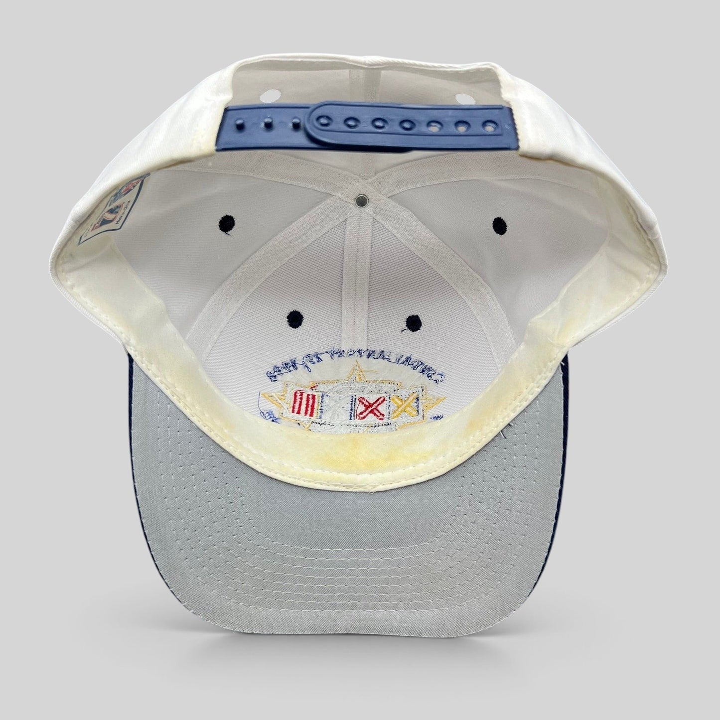 Raree Finds vintage 1998 Super Bowl XXXII snapback hat featuring a white crown, navy brim, and interior sweatband.