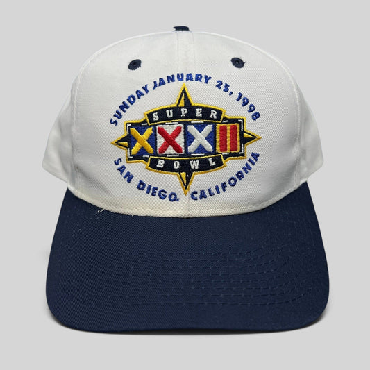 Raree Finds vintage 1998 Super Bowl XXXII snapback hat with white crown, navy brim, and embroidered San Diego logo.