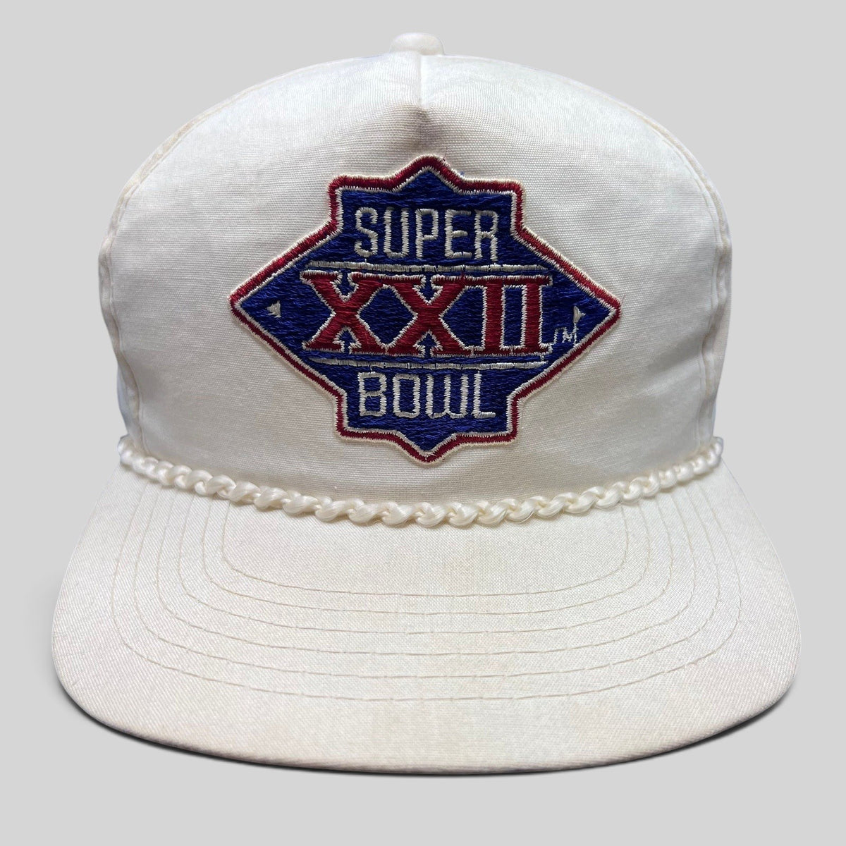 Raree Finds vintage 1988 Super Bowl XXII snapback hat in white cotton with a braided rope brim and embroidered logo.