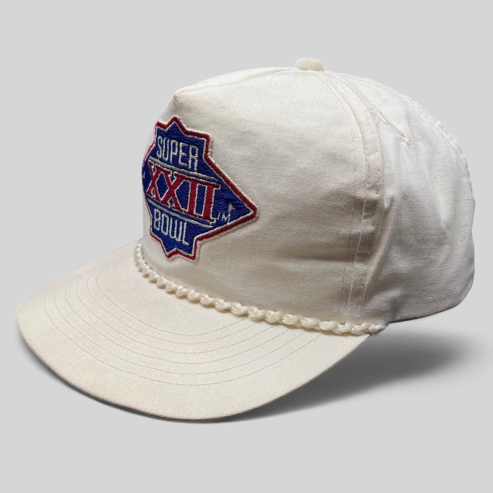 Raree Finds vintage 1988 Super Bowl XXII snapback hat in white cotton with a braided rope brim and embroidered logo.
