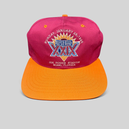 Raree Finds vintage 1995 Super Bowl XXIX snapback hat with a maroon crown, orange brim, and embroidered NFL logo.
