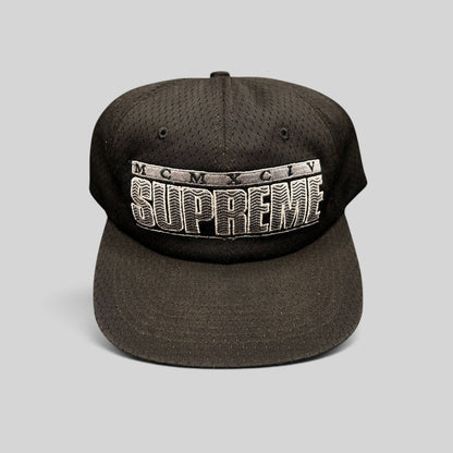 Raree Finds vintage black Supreme mesh snapback hat featuring raised 3D MCMXCIV embroidery and adjustable closure.