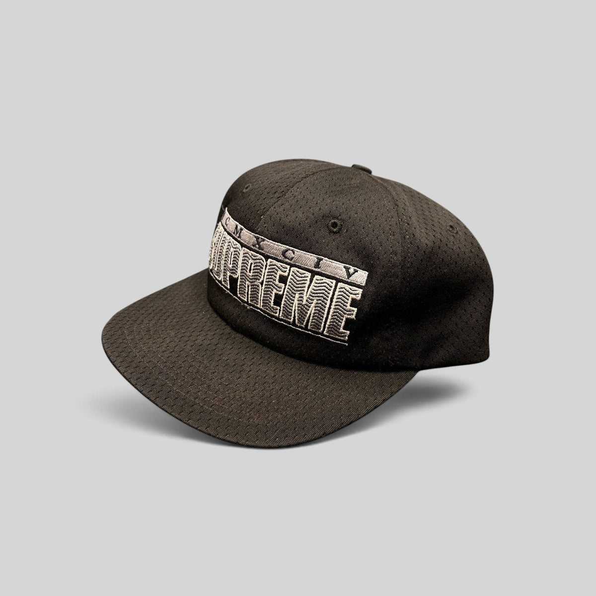 Raree Finds vintage black Supreme MCMXCIV mesh snapback hat with white 3D raised embroidery, made in USA.