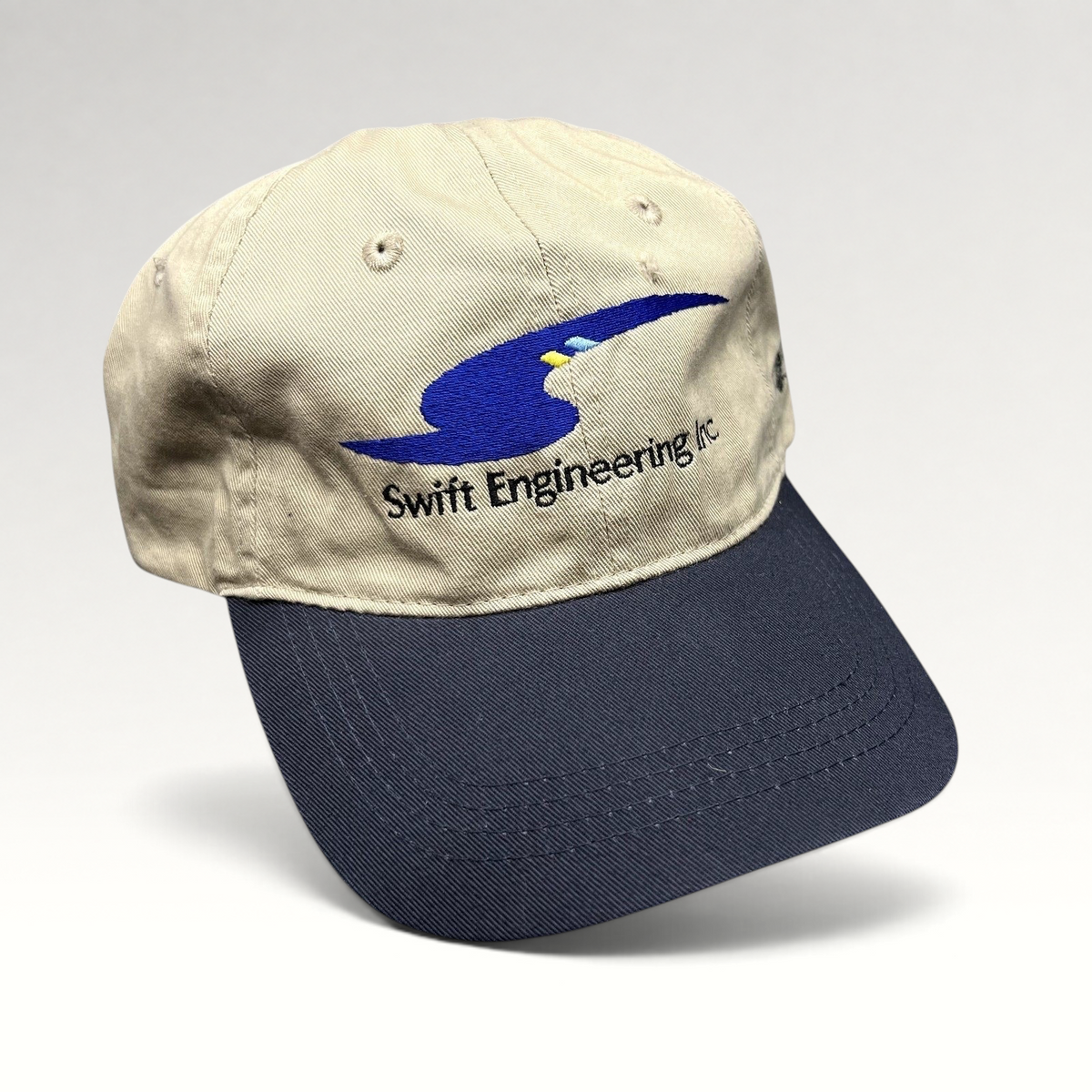 Raree Finds vintage Swift Engineering Inc two-tone khaki and navy cotton strapback hat with embroidered logo