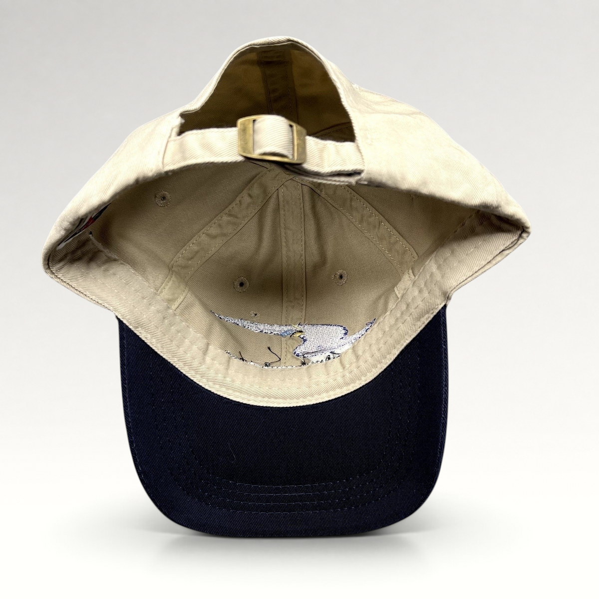 Raree Finds vintage Swift Engineering Inc two-tone khaki and navy cotton strapback hat with brass buckle closure